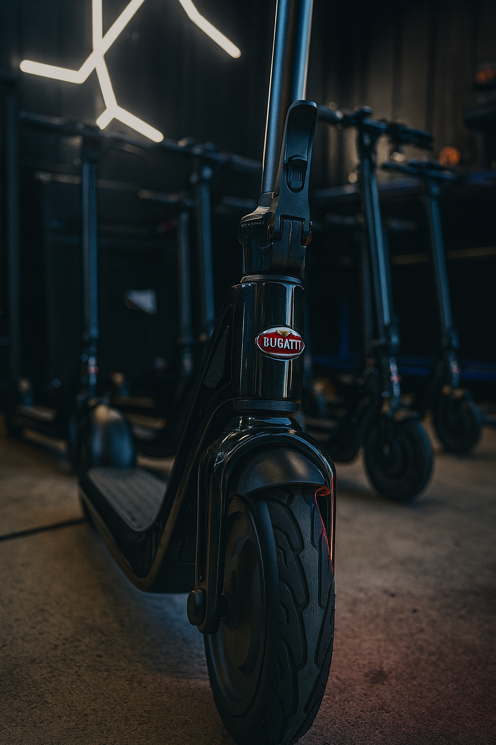 Close-up of a scooter with Bugatti logo in a dark setting
