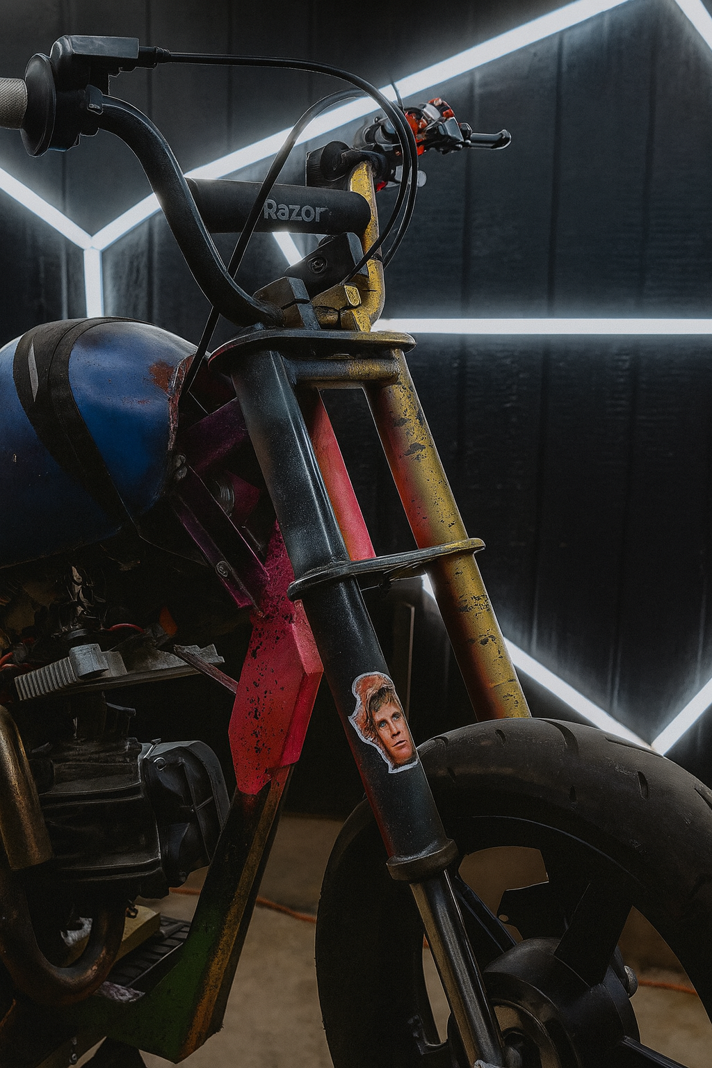 Vanta custom mini bike frame under construction — matte yellow frame and rear wheel detail